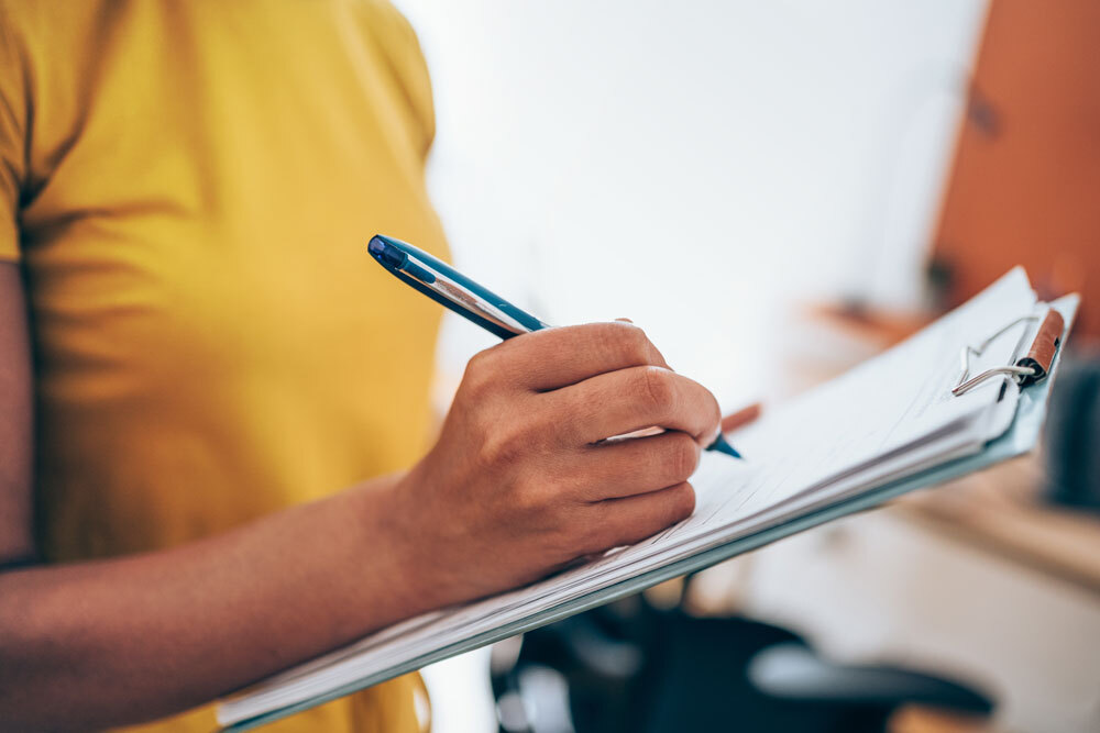 checklist for guidelines - person with a pen and clipboard