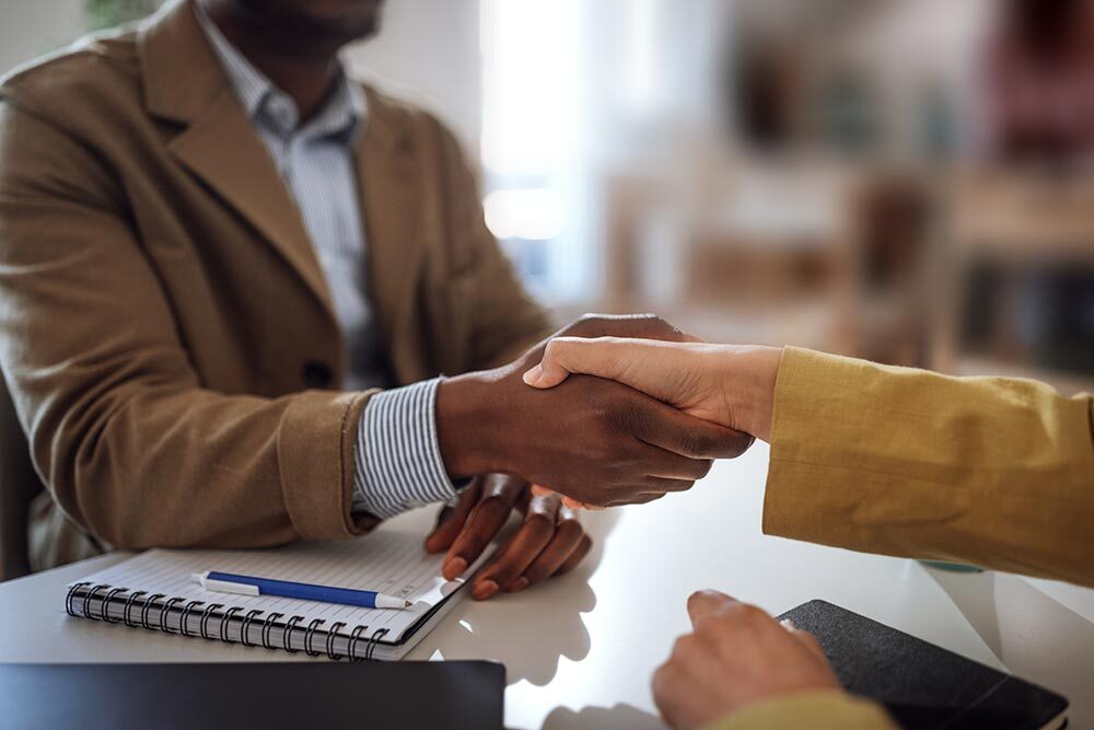 a handshake representing employment resources